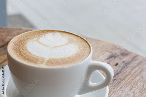 hot milk art coffee on wooden table