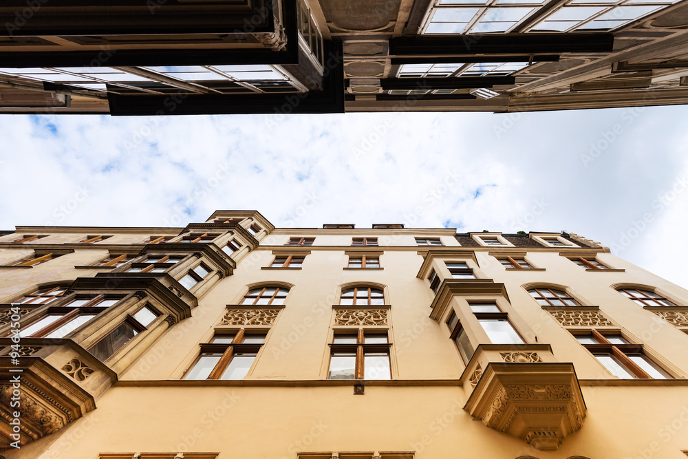 Fototapeta premium facades apartment houses on narrow street Vienna