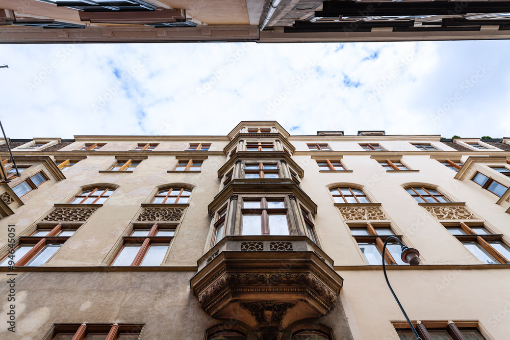 Naklejka premium apartment houses on narrow street in Vienna , Austria