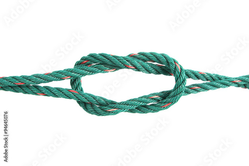 Green rope tied the knot on white background