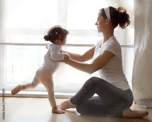  Ballet instructor directs little  ballerina during dance practice
