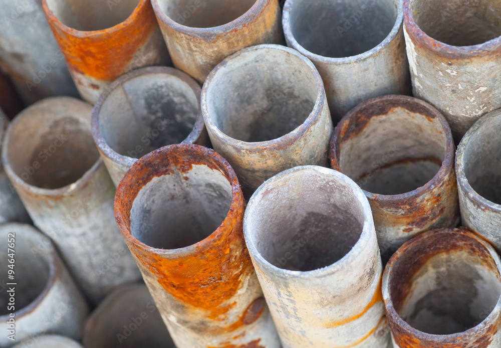 Close - up Stack of construction metal pipes..