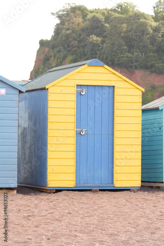 A blue and yellow wooden beach in Teignmouth, Devon, England © martincp