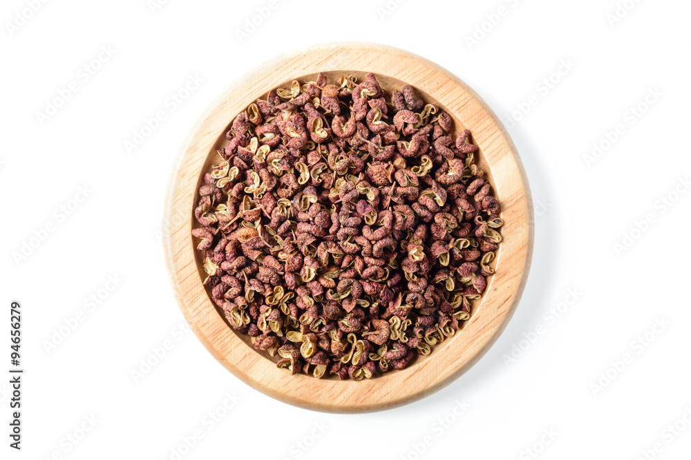 dry pink pepper in the wooden plate dry pink pepper in the wooden plate