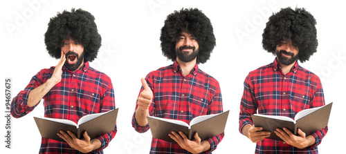 Afro man reading book