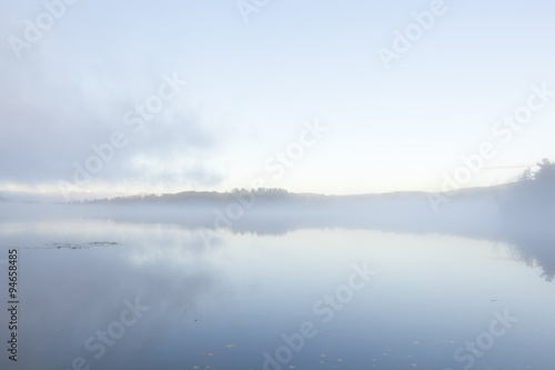 A foggy sunrise on Onota Lake in the Berkshire Mountains of Western Massachusetts.