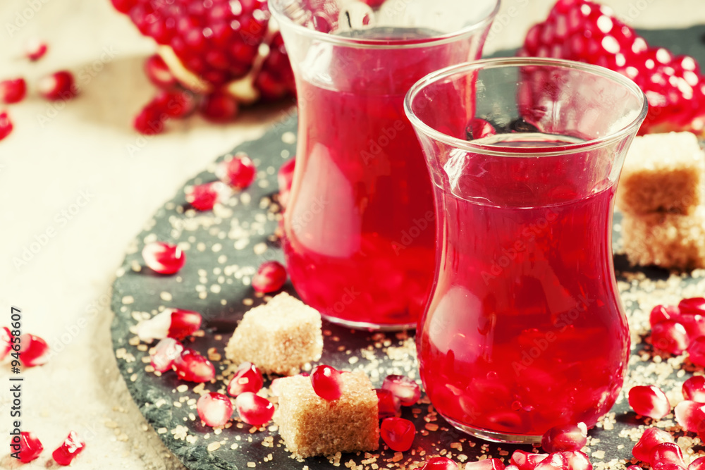 Hot red tea with pomegranate and cane sugar in authentic Middle Hot red tea with pomegranate and cane sugar in authentic Middle