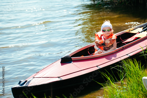 Little girl in a kayak. Family holiday. © davit85