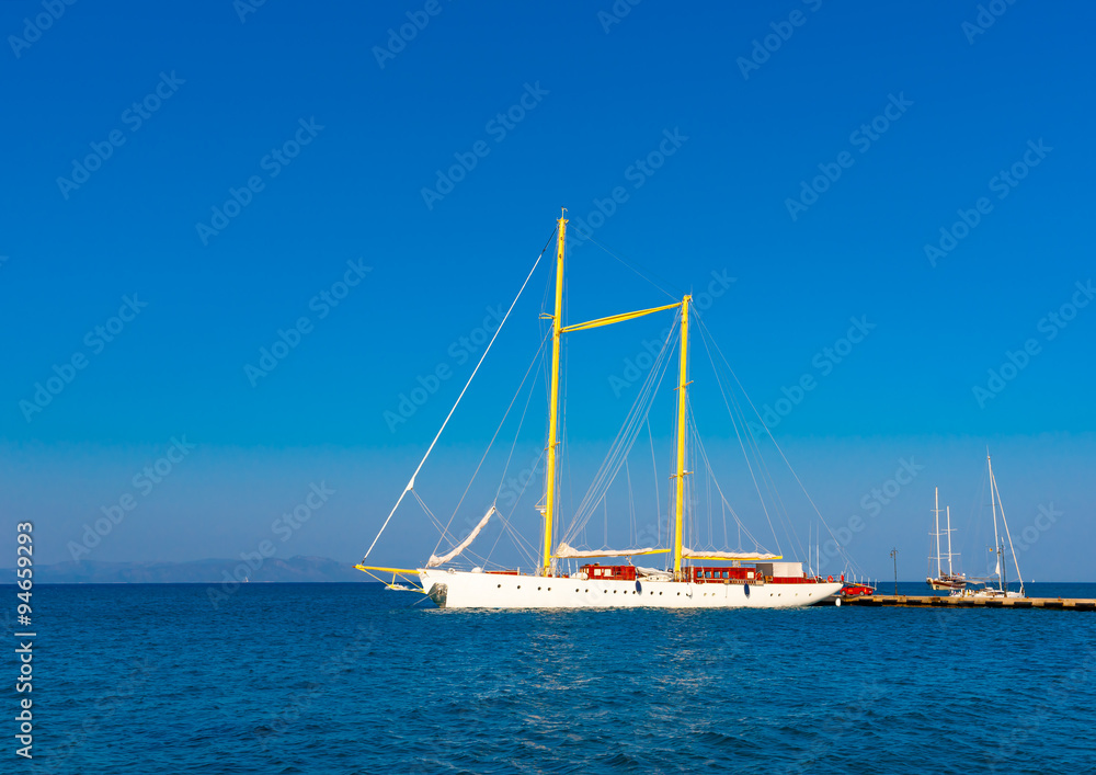 beautiful big old sailing boat docked at the port of Kos island in Greece