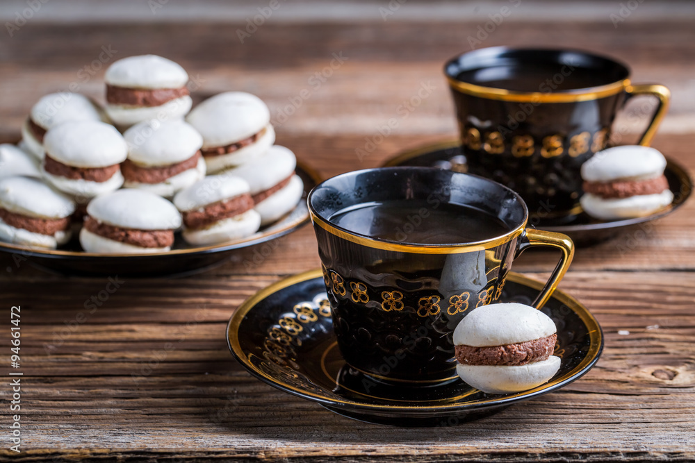 Cup of coffee and chocolate macaroons Cup of coffee and chocolate macaroons