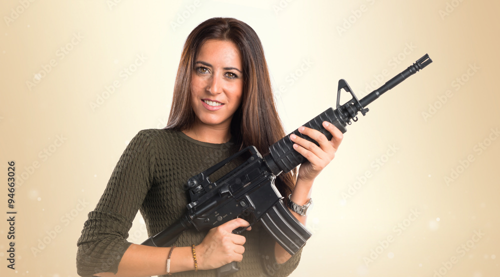 Woman holding a SMG Woman holding a SMG