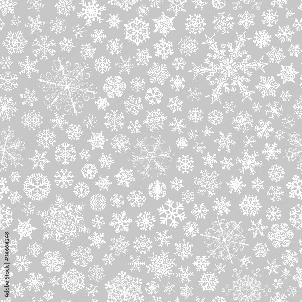 Seamless pattern of snowflakes, white on gray Seamless pattern of snowflakes, white on gray