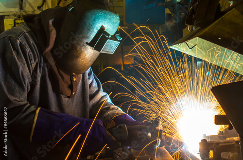 Welder movement Industrial automotive part in factory