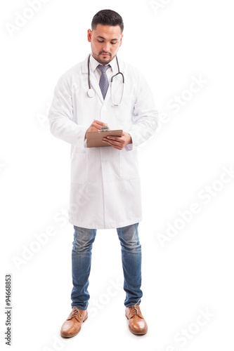 Male doctor taking some notes