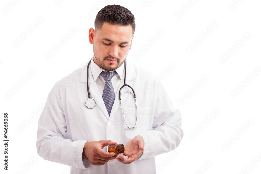 Male nutriologist with some pills Male nutriologist with some pills