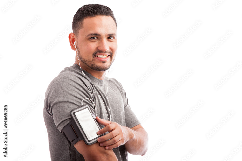 Latin athlete finding his favorite playlist Latin athlete finding his favorite playlist