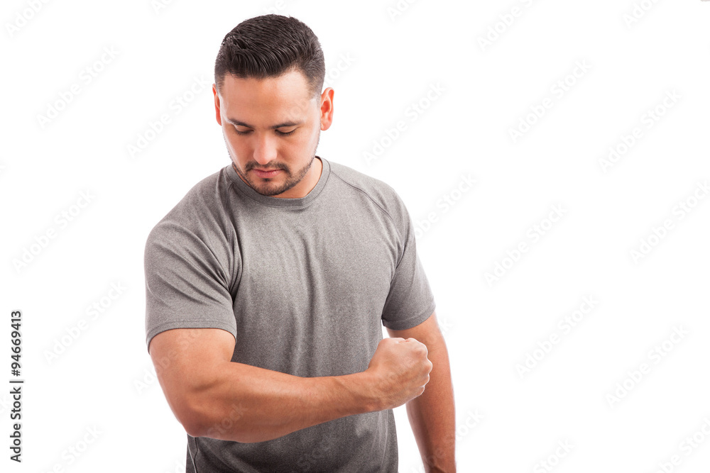 Strong man showing his muscles Strong man showing his muscles