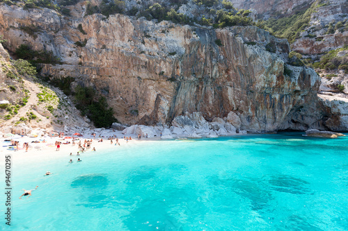People on one of the beautiful beach in Sardinia, Italy