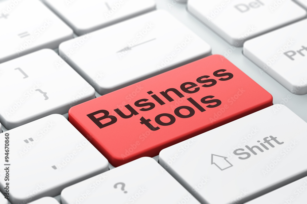 Finance concept: Business Tools on computer keyboard background Finance concept: Business Tools on computer keyboard background