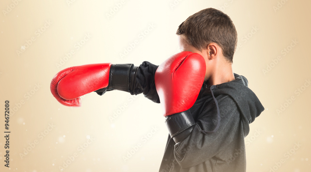 Kid with boxing gloves Kid with boxing gloves