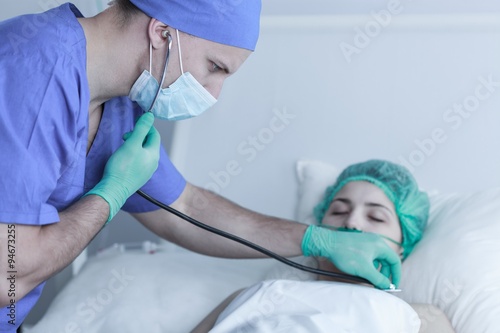 Doctor examining patient after operation