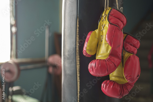 Boxing gloves/Boxing gloves hanging on sandbag.