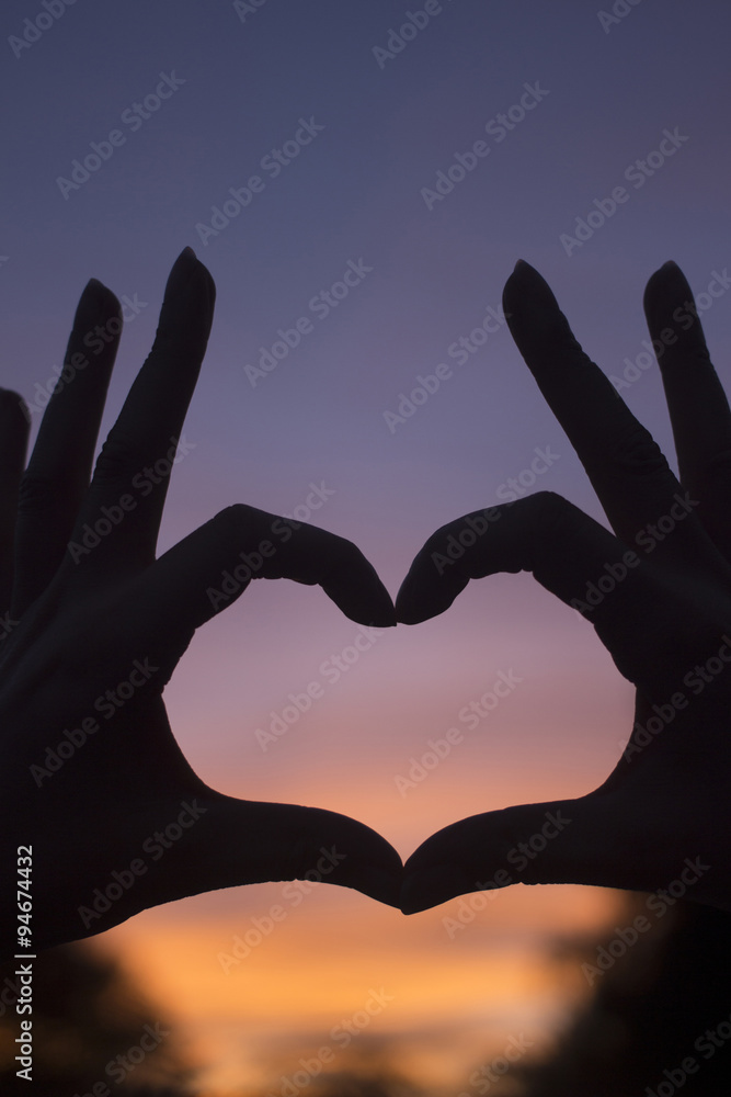 Heart shape hands at dusk silhouette sunset sky Heart shape hands at dusk silhouette sunset sky