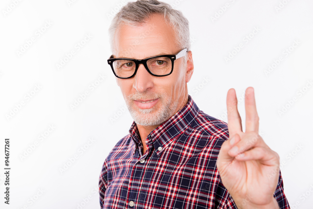 Gray aged man with glasses gesturing two fingers Gray aged man with glasses gesturing two fingers
