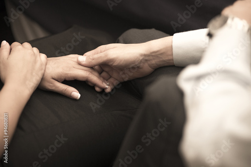Man and woman holding hands in wedding banquet marriage party