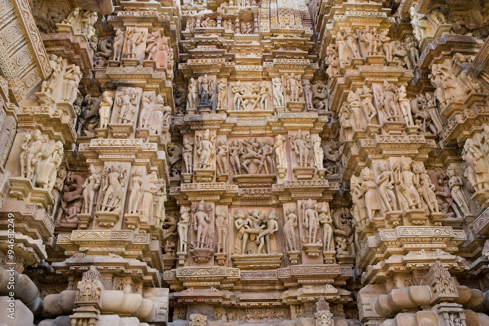 Stone carved erotic bas relief in Hindu temple in Khajuraho, India. Unesco World Heritage Site