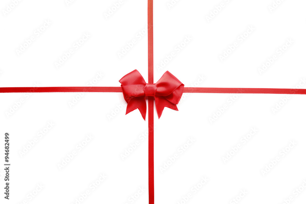 Shiny red ribbon with bow isolated on white Shiny red ribbon with bow isolated on white