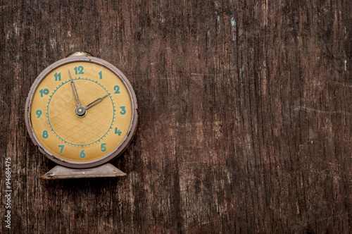 Wallpaper Mural Vintage background with retro alarm clock on table Torontodigital.ca
