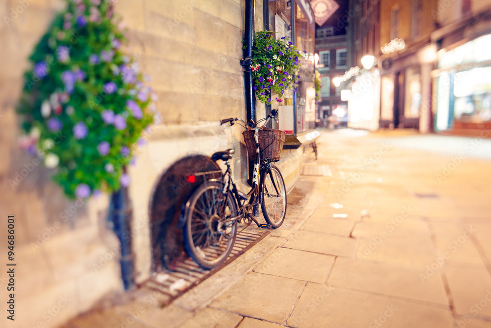 Cambridge at Night, Stylish Bike with Basket Left on the Street Cambridge at Night, Stylish Bike with Basket Left on the Street