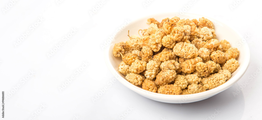 Dried white mulberry in white bowl over white background Dried white mulberry in white bowl over white background