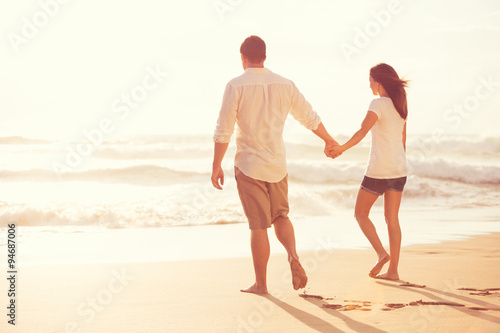 Romantic Young Couple on the Beach at Sunset