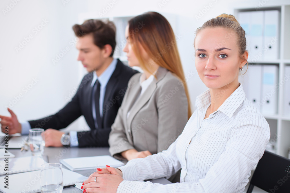 Group of Business people at meeting, focus on blond business woman Group of Business people at meeting, focus on blond business woman