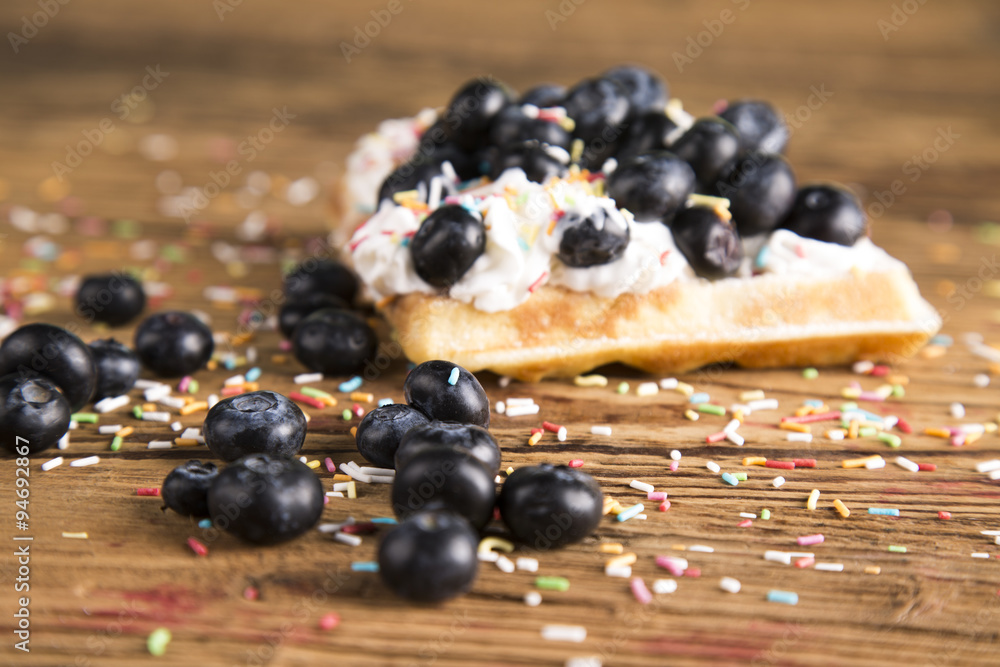 Waffles with whipped cream and raspberries and cranberries
Waffles with whipped cream and raspberries and cranberries