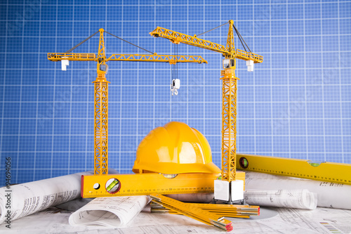 Buildings under construction and cranes
