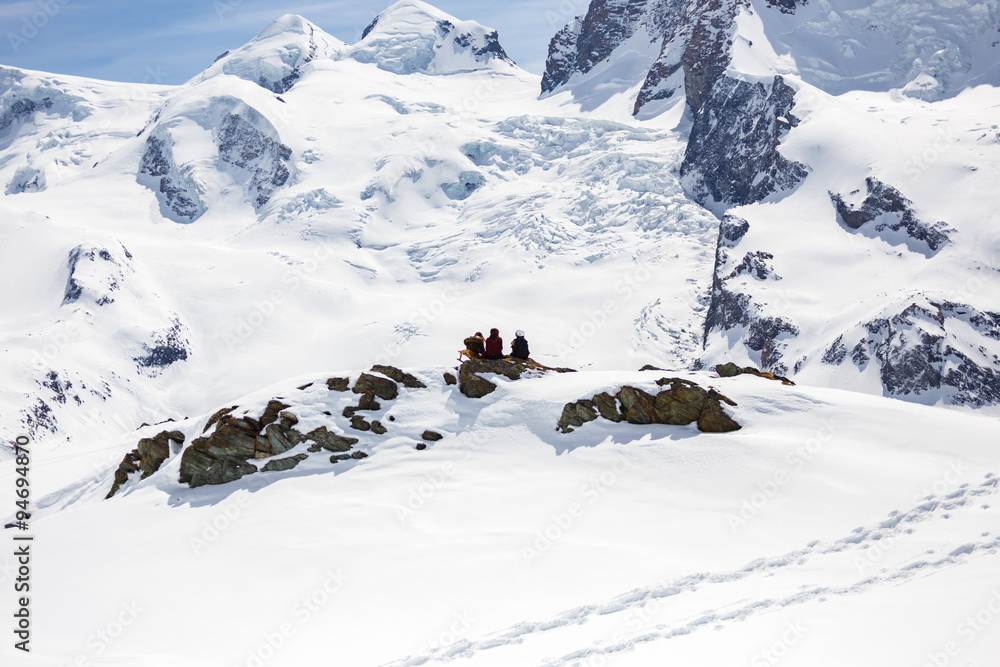 A picnic group with background of snow mountain