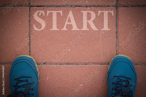 Blue shoes on the sidewalk in front of Straton, the beginning. photo