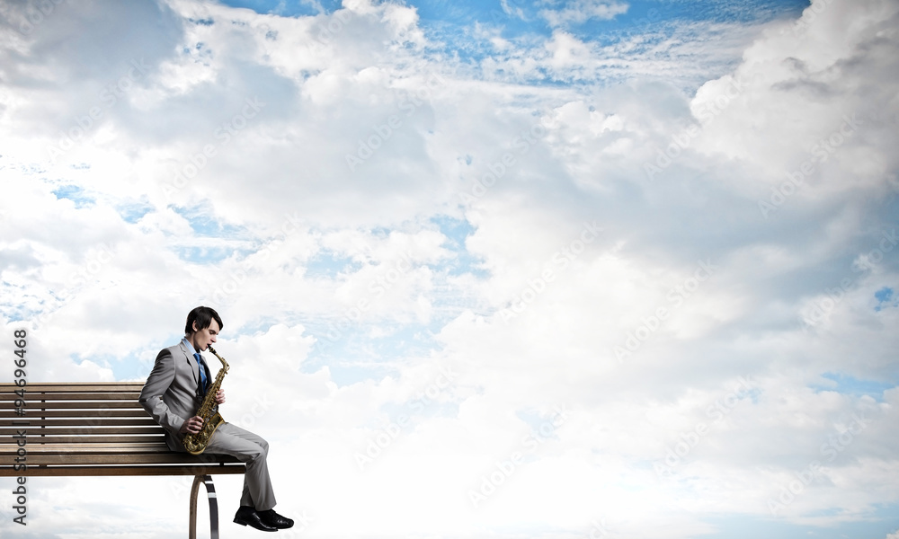 Handsome saxophonist. Concept image Handsome saxophonist. Concept image