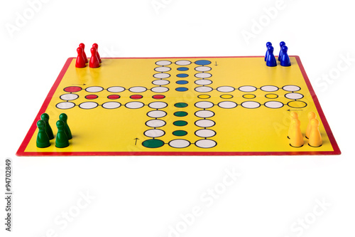 Board game with different colored game pawns on it