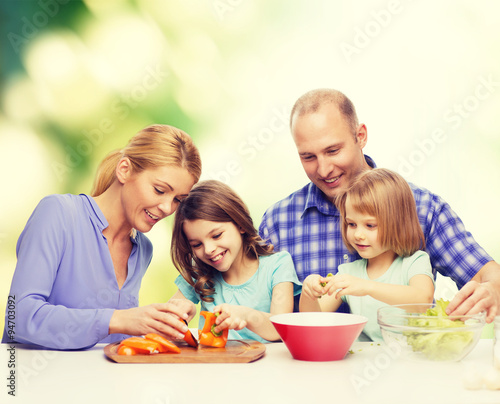 happy family with two kids making dinner at home