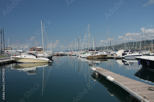 Motor boats and sailboats in harbor in Trieste, Italy