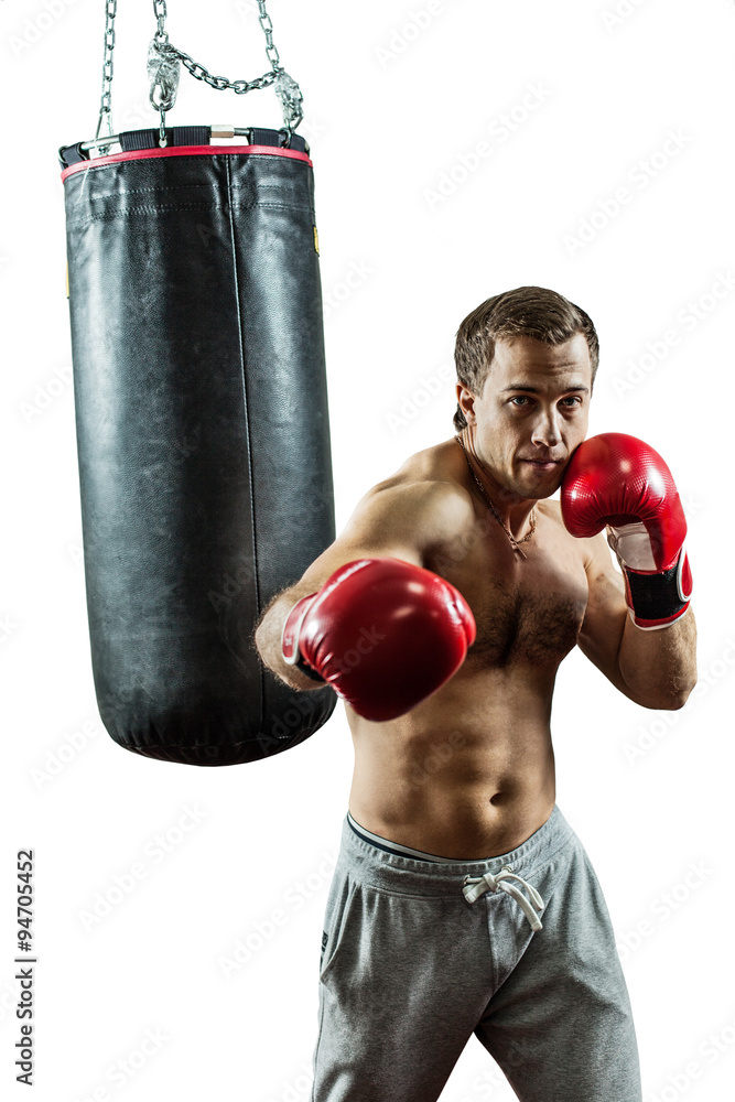 Muscular boxer near the boxing bag. Isolated on white background