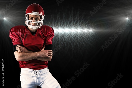 Portrait of american football player with arms crossed