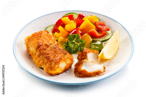 Fish dish - fried fish fillets and vegetables 