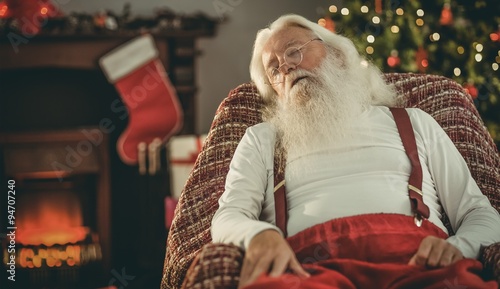 Santa claus napping on the armchair