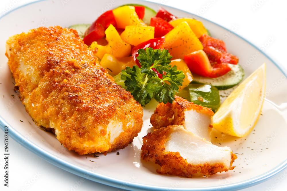 Fish dish - fried fish fillets and vegetables Fish dish - fried fish fillets and vegetables