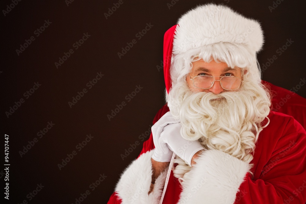 Composite image of happy santa claus holding his sack Composite image of happy santa claus holding his sack